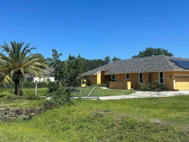 Building Photo - Beautifully Renovated Pool Home in The Acreage - 3bed | 2.5bath