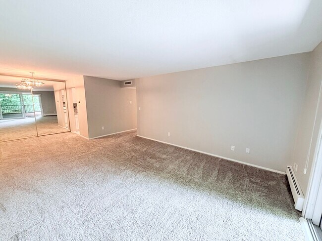 Building Photo - Large 1BR Condo with Patio, Heated Parking, Pool, Sauna & Tennis Courts!