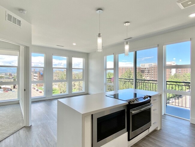 Building Photo - Luxury Top-Floor Condo with Stunning Mountain & City Views