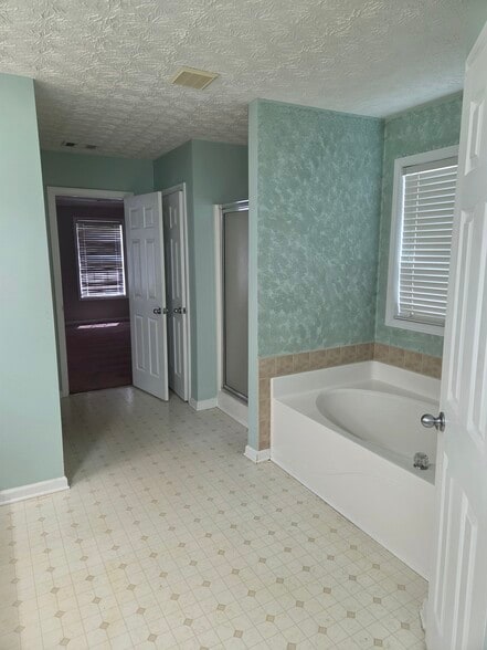 Primary tub and shower - 1359 River Club Dr NE