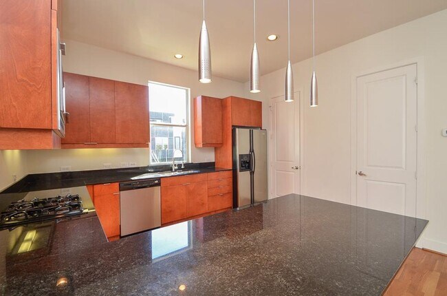 Building Photo - Stylish Corner Townhome Steps from Parks, Dining & Shopping