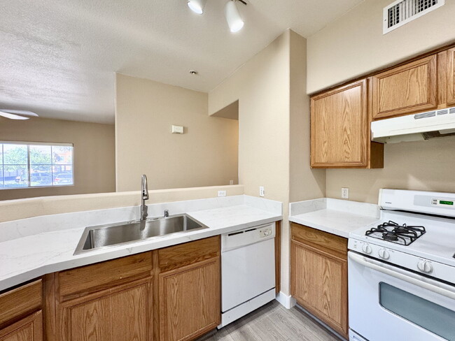 Building Photo - DOWNSTAIRS CONDO | GATED COMMUNITY | CENTENNIAL HILLS | UPDATED 3 BEDROOM
