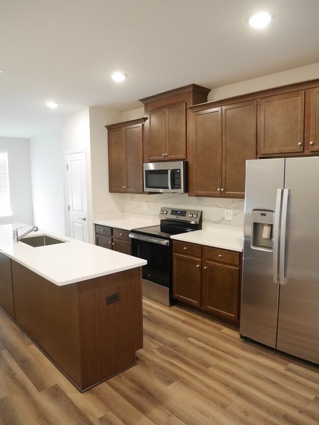 Building Photo - NEW BUILD! Four Bedroom Townhome- Prime Lo...