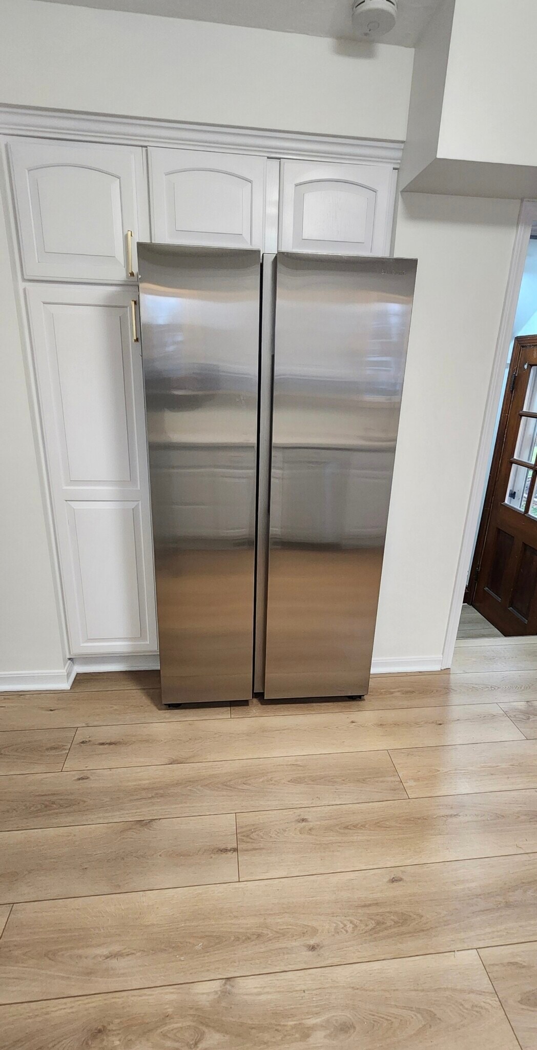 Updated kitchen featuring a premium Samsung stainless steel refrigerator, paired with stainless rang - 90 E 216th St