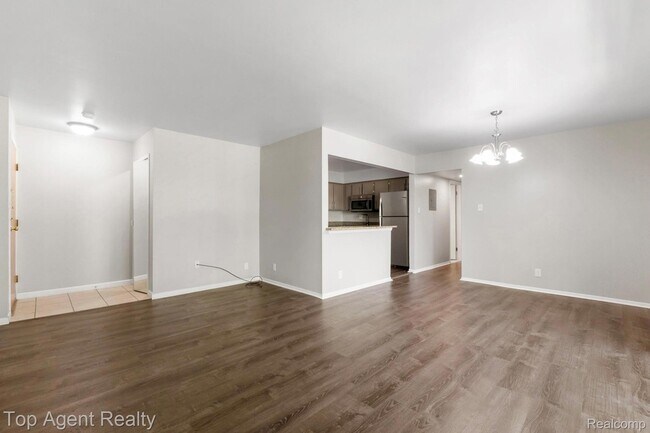 Building Photo - 8657 Kennedy Cir N