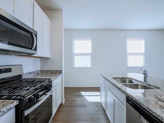 Building Photo - Stunning Brand New 4-Bedroom 2.5-Bathroom with large enclosed backyard!