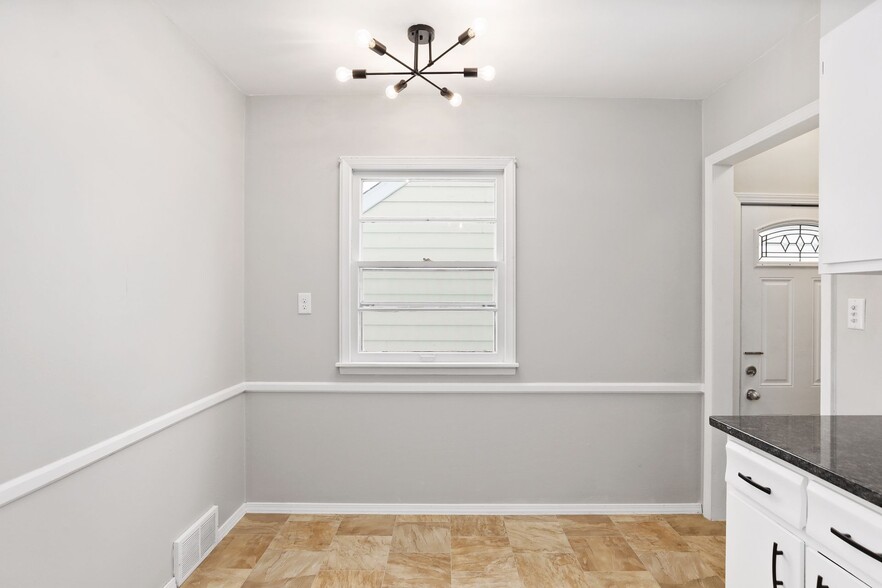 Dining table nook and back entrance - 1395 Taylor Ave W