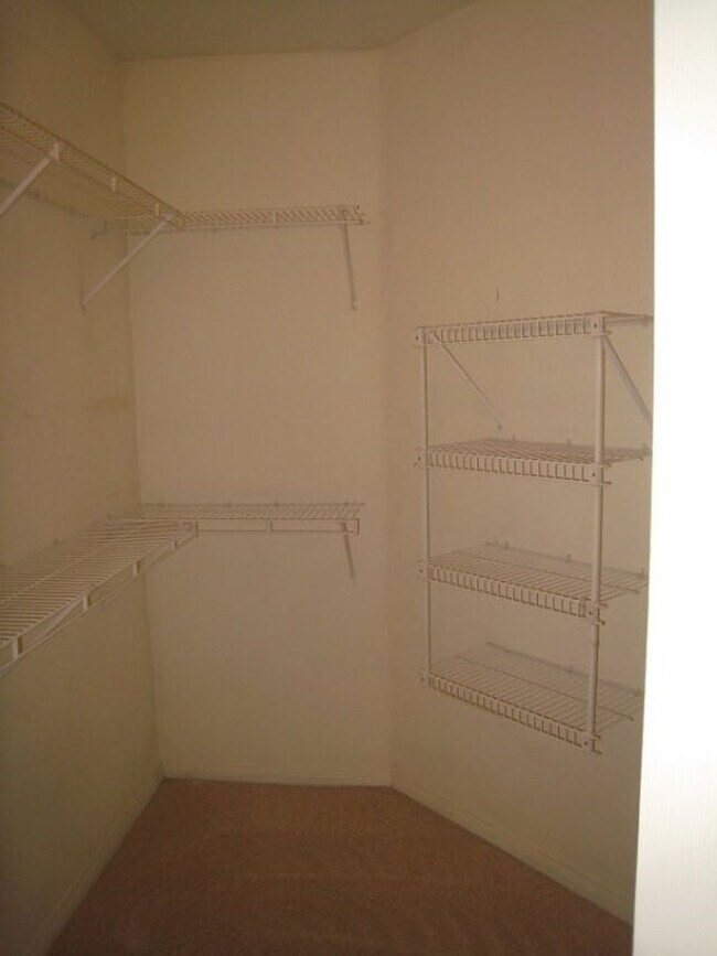 Building Photo - 2nd Story Condo in gated community close to the pool.