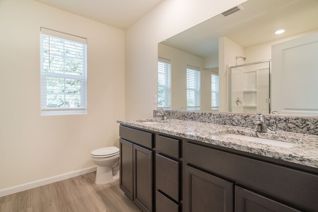 Building Photo - Super clean & spacious 4-bdrm/3-bath townhome in NE—Attached garage, great location