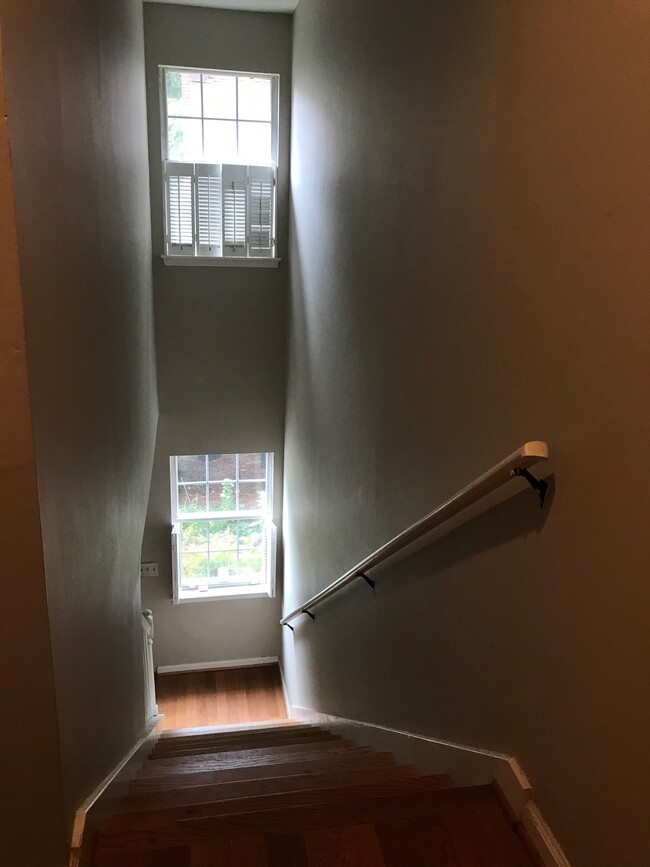 Stairwell with beautiful window and wood shutters. - 107 Swanton Hill Ct