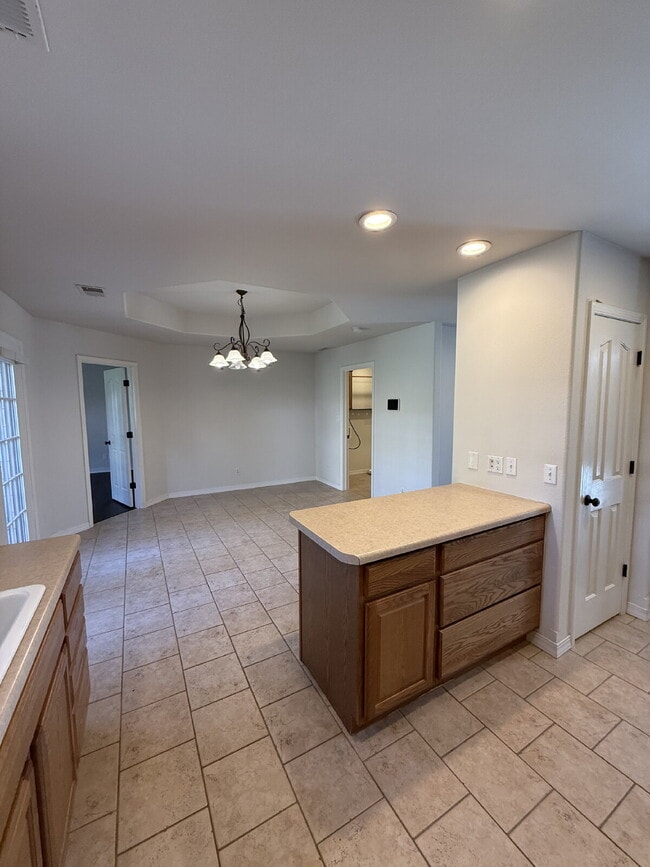 Building Photo - Spacious 3 BR with a fenced in backyard