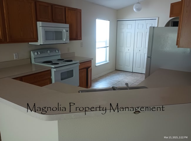 Building Photo - New Paint, Floors and Solid Surface Counte...
