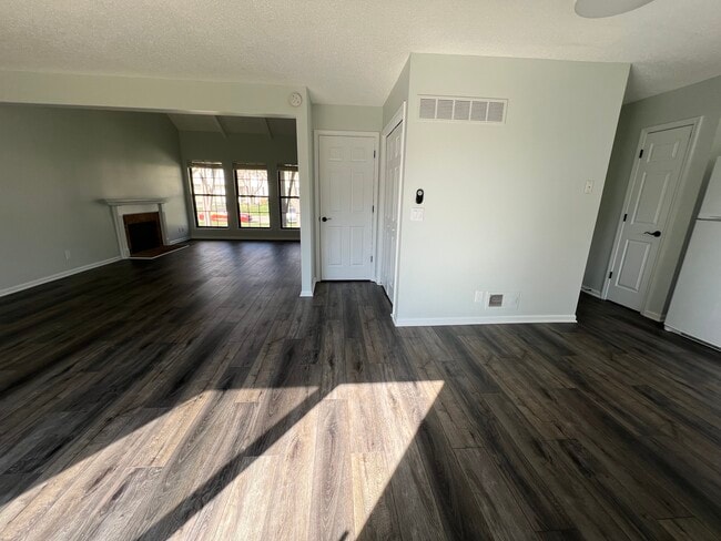 Living room/basement door/closet/kitchen/back hallway - 14103 W 88th Terrace