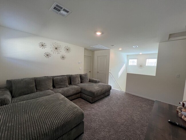 Building Photo - FULLY FURNISHED!!! beautiful 3 bedroom 2 and half bath home is located in the Symmetry Bay Cadenc...