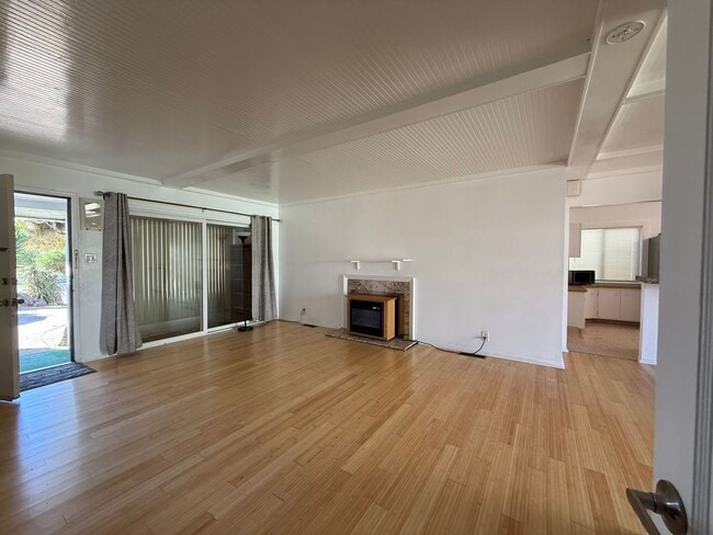 Building Photo - Hard floors, extra closets, patios & fence...