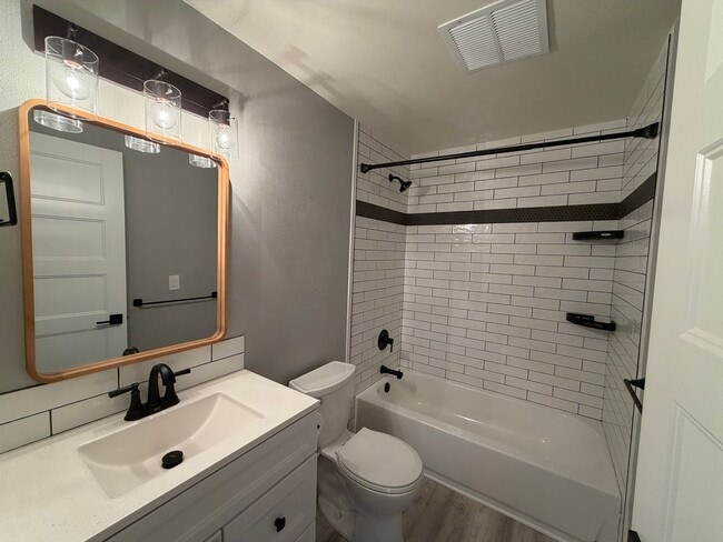Building Photo - Spacious 4BR/3BA Home with Deck, Fenced Yard & Garage