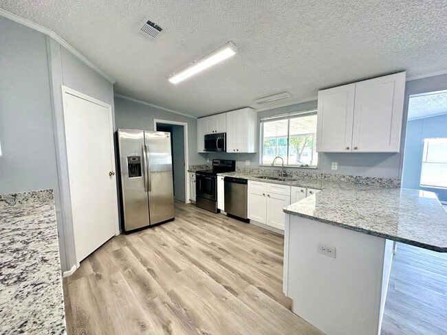 Building Photo - Privacy and Space in this 3/2 Home at the ...
