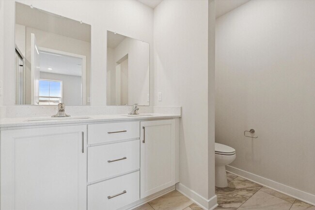 Building Photo - Brand New River Pointe townhome with modern finishes, flexible living space, and a prime location...