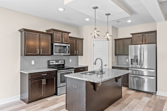 Building Photo - Pet Friendly Three Bedroom with Bonus!