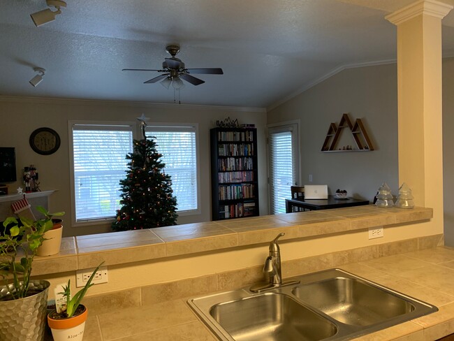 View of Living room from Kitchen - 15058 NW Central Dr