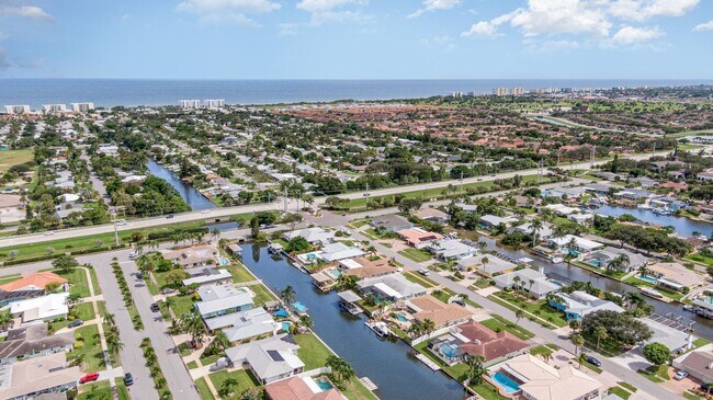 Building Photo - Enjoy the pool or fish/kayak/boat from the...