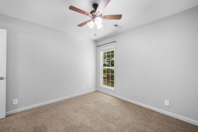 Building Photo - Stunning Stone Fireplace • Finished Basement • Fenced Yard
