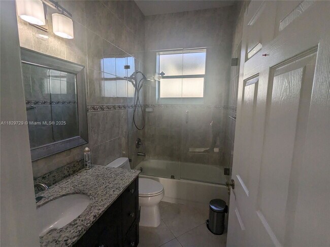 Building Photo - Northwest 91st Court, Hialeah Gardens, FL 33018 - 3 BR 1 BA single-family home