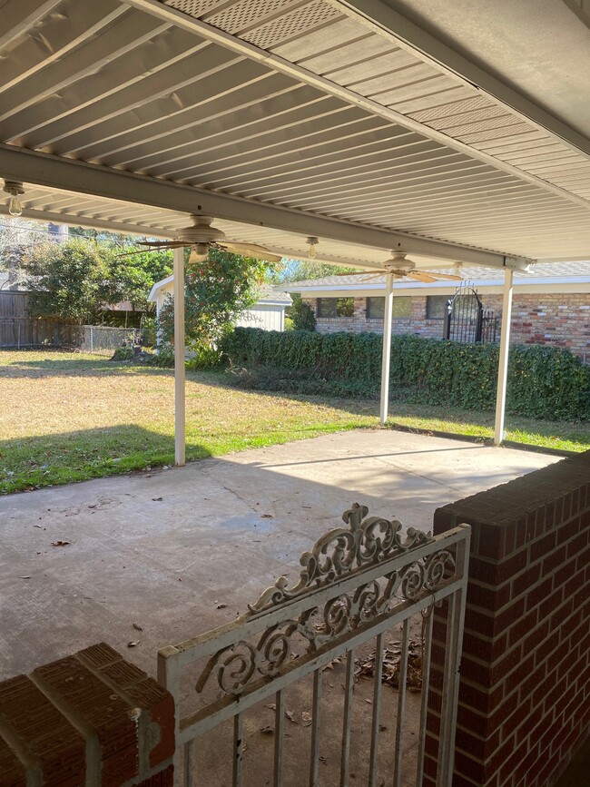 View of Covered Outdoor Patio from Carport Side Door - 2312 Bienville Dr