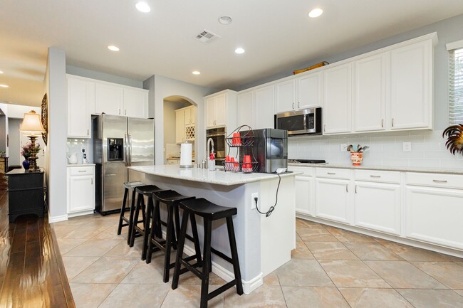 Building Photo - Stunning 4 bedroom 3.5 bath home with 3 ca...