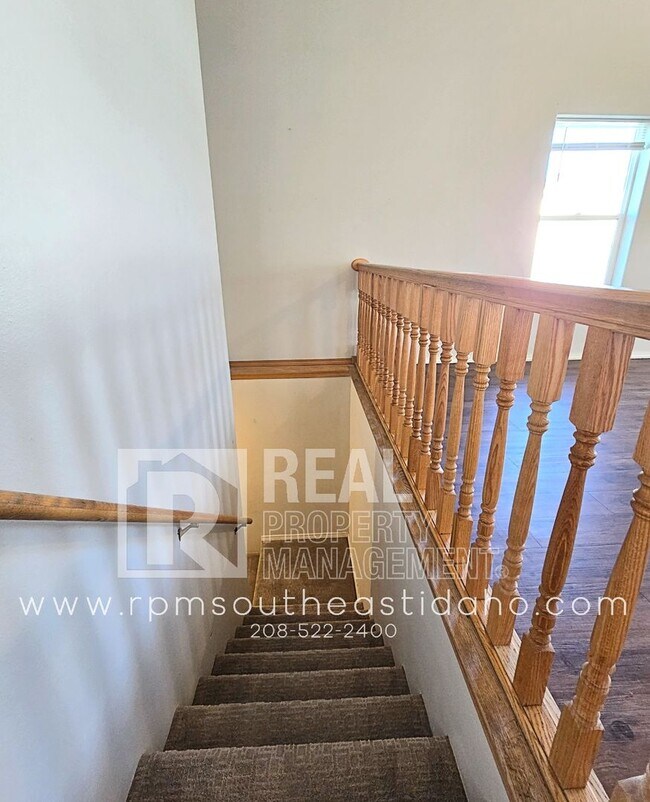 Building Photo - Spacious & Updated 2 Bedroom, 2 Bathroom Twin Home in Ammon with Fenced Backyard and Hookups (Ida...