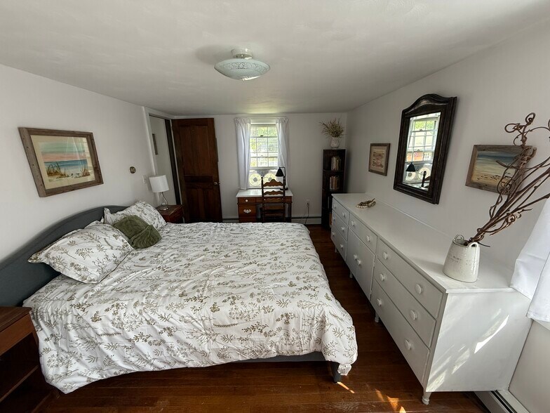 Bedroom 1 queen bed with built in dresser, desk, and corner bookshelf. - 32 Meadow St