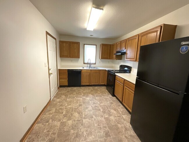 Building Photo - For Rent - 4 Bedroom, 2 Full Bath Home with Ground-Floor Bedroom, Attached Garage and Brand-New K...