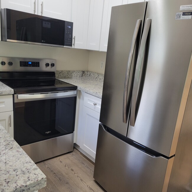 refrigerator with icemaker and water dispenser - 2031 NE 56th St