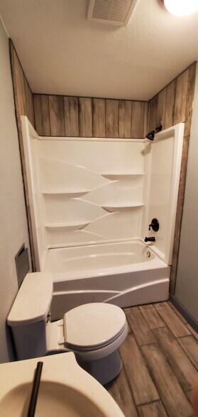 Second Restroom with tile floor and around tub - 522 Soechting