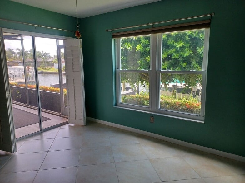 Building Photo - UPGRADED WATERFRONT END UNIT 3 BR / 2 BA Home With BOAT LIFT/ DOCK & OUTSTANDING VIEWS