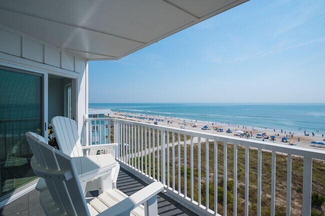 Building Photo - SPEND YOUR OFF-SEASON AT THIS TOP FLOOR OCEANFRONT CONDO