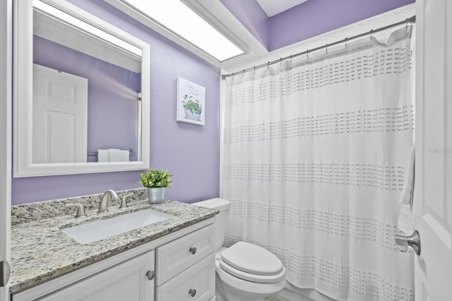 Second full bathroom with modern updates and clean design. - 1932 Brainerd Ct