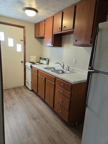 Kitchen has new flooring, counter, sink - 1301 Grace St