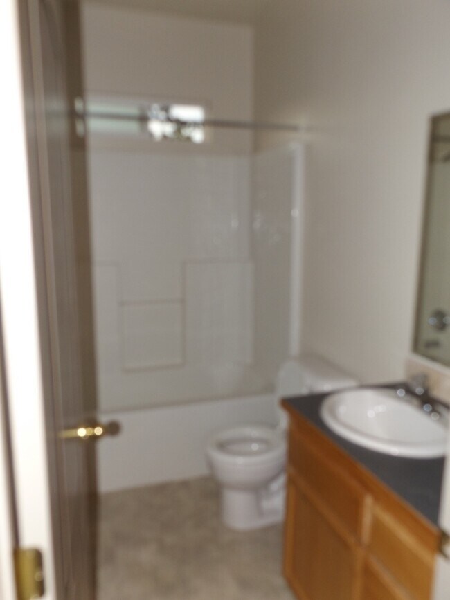 Building Photo - Spacious 3 Bedroom, 2 Bathroom Duplex with Two Car Garage and Fenced Yard!