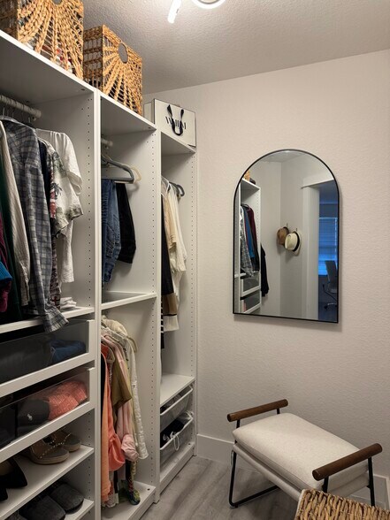 Primary walk in closet - 10075 Gate Pky N