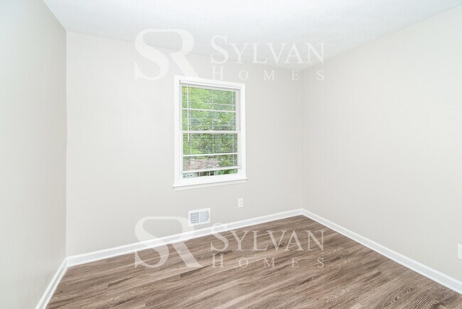 Building Photo - Welcome to this charming abode.