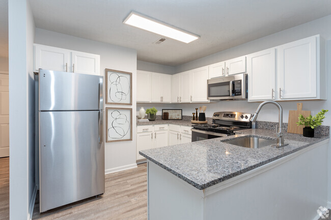 Modern Kitchen with Granite Countertops & Stainless-Steel Appliances - Timber Woods