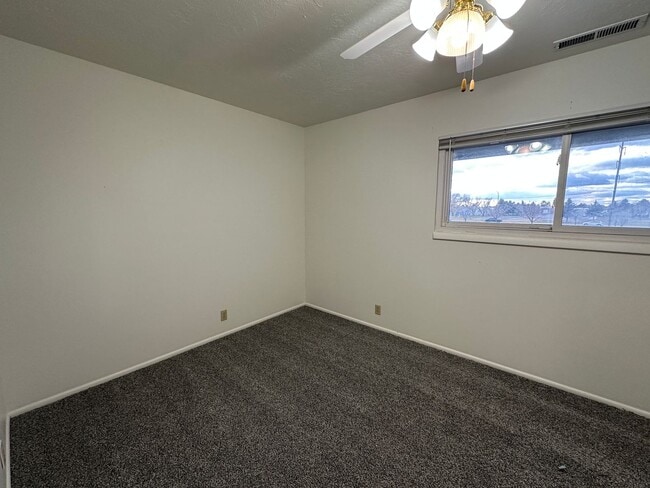 Building Photo - Spacious, three level, 4 Bed 2.5 bath Townhome in Ammon right behind the Walmart on Hitt.