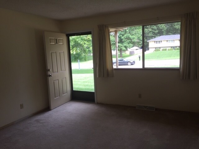 Living room with the front entrance. - 12601 Blue Ridge Ext