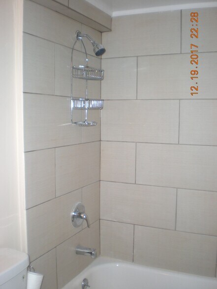 Full bathroom for lower level with new tile and tub - 1160 Clinton St