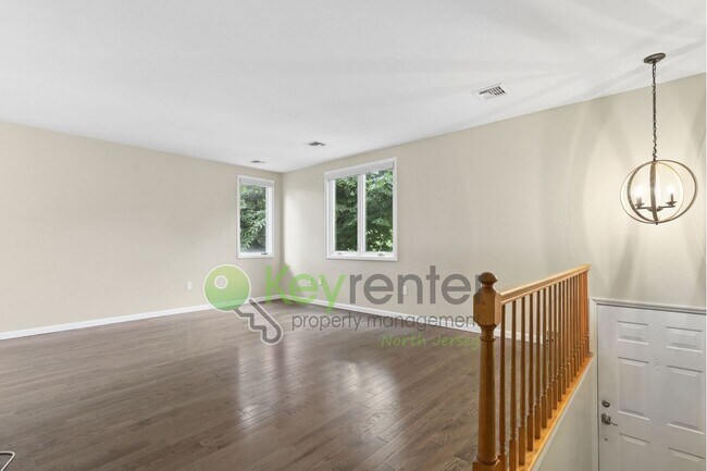 Building Photo - Spacious 2BR/2BA Duplex in Gated Community with Parking, Washer/Dryer & NYC Skyline Views