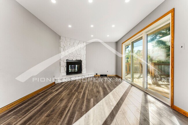 Building Photo - Spacious Home with Natural Light & Fenced Backyard