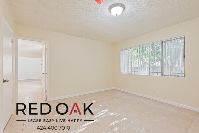 Building Photo - Spacious Two Bedroom with Tile Floors, Lar...