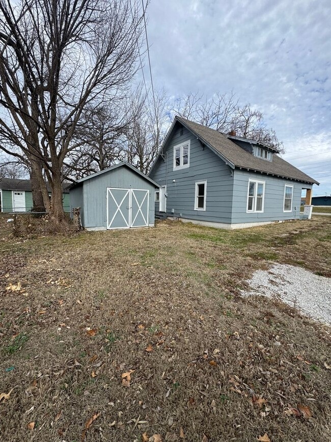 Building Photo - 4 bedroom/1 bath house w/storage building