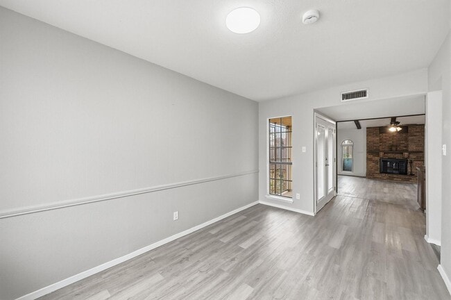 Building Photo - Charming 3-Bed Brick Home with Spacious Layout, Updated Floors & Cozy Fireplace in Grand Prairie